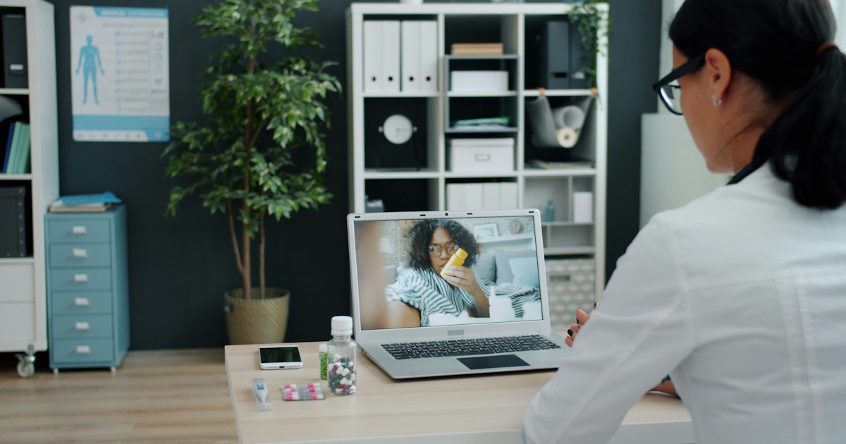 A person talking to a physician online
