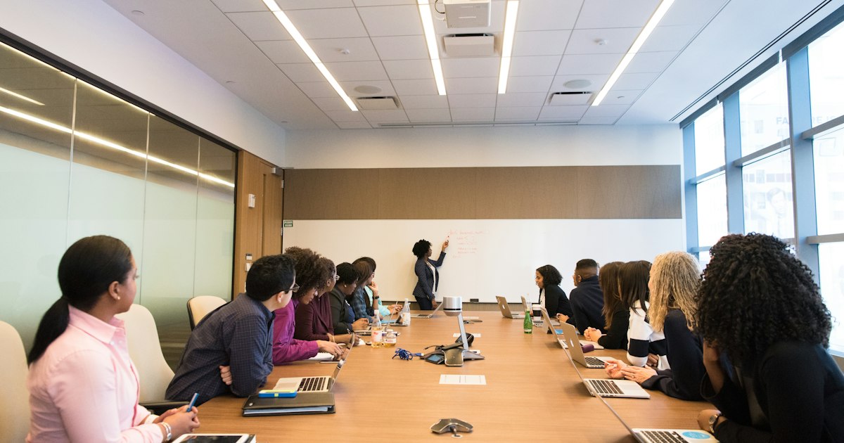 In-person business meeting around a table